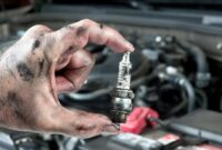Tune hood unrecognizable mechanic repairman shining screwdriver